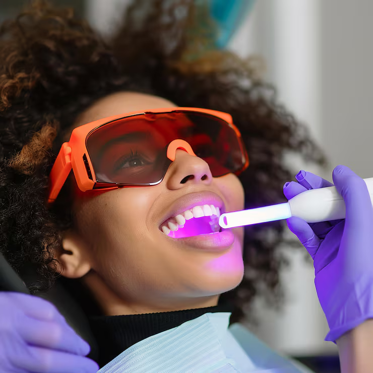 woman is wearing gloves toothbrush with smile that says smile 1077535 9059